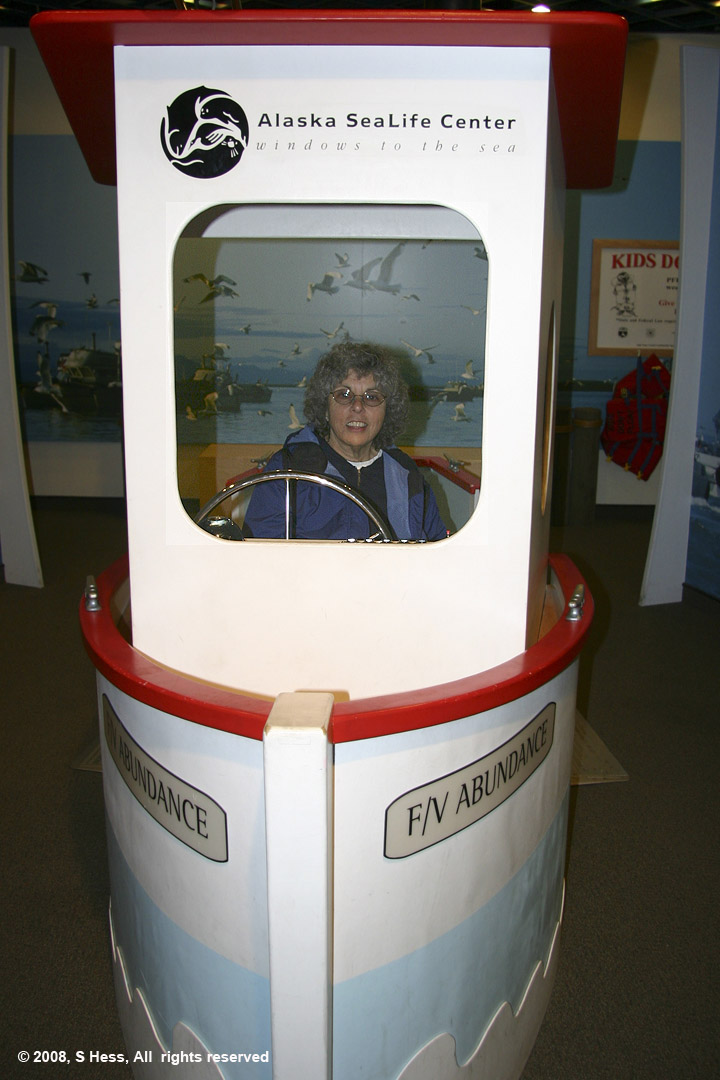 Susie in a boat in the children's area of the Alaska Sea Life Center